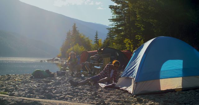 Family Enjoying Outdoor Camping by Lakeside in Morning Sunlight - Download Free Stock Images Pikwizard.com