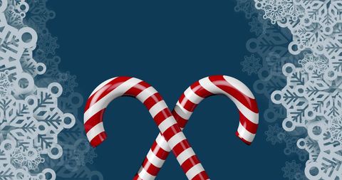 Candy Canes Surrounded by Intricate Snowflakes on Navy Blue Background - Download Free Stock Images Pikwizard.com