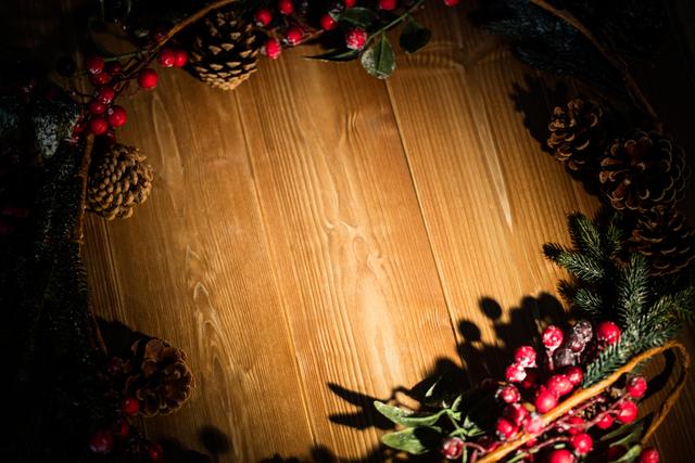 Christmas Decorations on Wooden Plank with Pinecones and Berries - Download Free Stock Photos Pikwizard.com