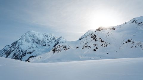 Breathtaking Snow-Capped Mountains at Sunrise