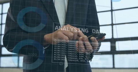 Businessman Analyzing Digital Data on Mobile Device - Download Free Stock Images Pikwizard.com