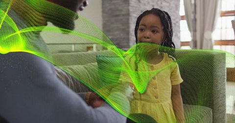 African american parent and daughter sharing quiet conversation on sofa with neon green wave