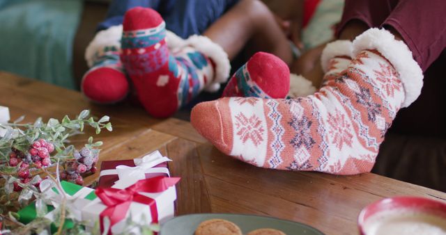 Close up of african american family playing with socks. Spending quality time with family at christmas concept.