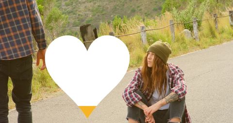 Friends Hanging Out On Roadside In Cozy Streetwear Fashion