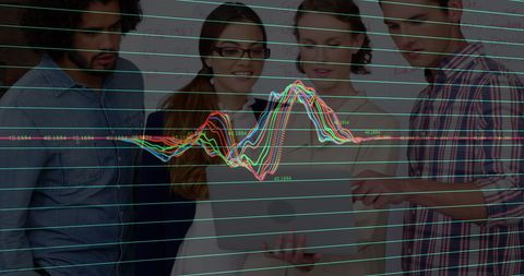 Diverse Business Team Collaborating on Data Analytics in Office