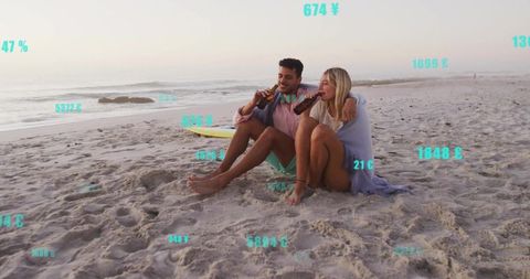 Couple Relaxing on Beach with Surfboard at Twilight