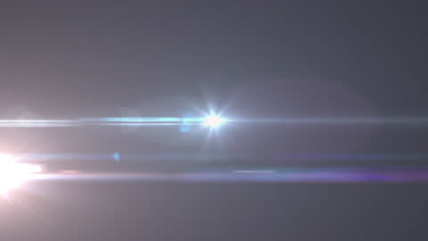 Dynamic Light Streaks and Flares on Dark Background