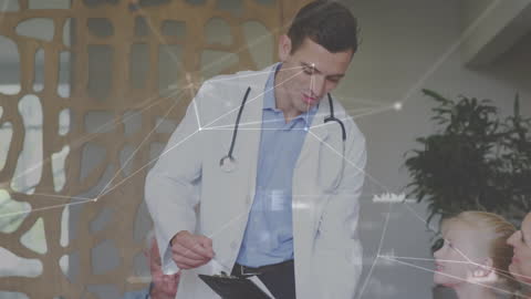 Male Doctor Explaining to Child with Digital Interface