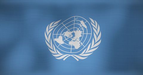 Waving united nations flag symbolizing global unity