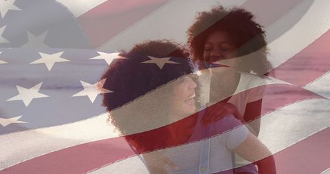 Mother and Daughter with American Flag Celebrating Patriotism