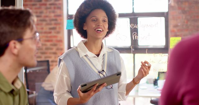 Young businesswoman leading creative meeting in modern office - Download Free Stock Images Pikwizard.com