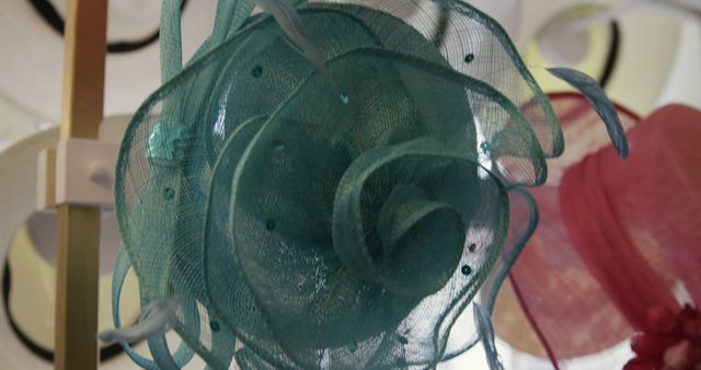 A teal fascinator on display, with copy space - Download Free Stock Photos Pikwizard.com