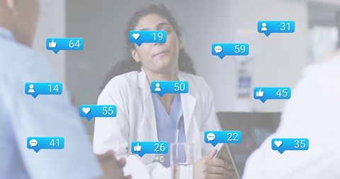 Clinician leading hospital roundtable with social engagement notification overlays