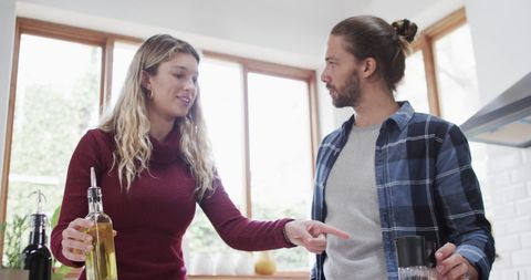 Couple Enjoys Cooking Together at Home in Bright Kitchen