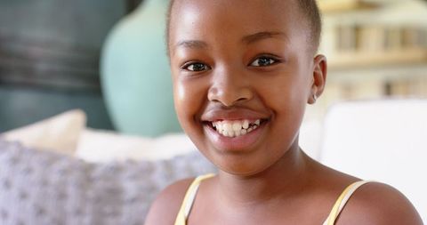 Joyful Young Girl Smiling Cheerfully Indoors