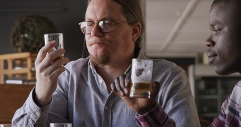 Diverse Friends Enjoying Beer Tasting in Microbrewery Pub