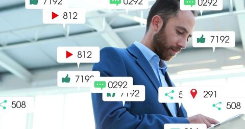 Businessman Engaging with Social Media Analytics on Device in Modern Office