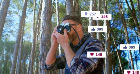 Nature Photographer in Forest Capturing Scenic Beauty