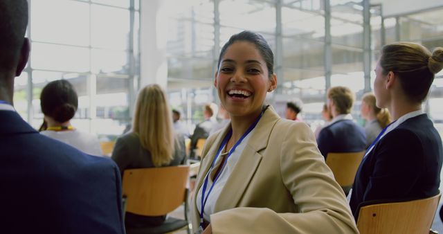 Smiling Businesswoman Attending Professional Conference in Office Environment - Download Free Stock Images Pikwizard.com