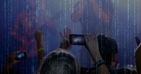 Fans capturing concert on smartphones with digital effects overlay