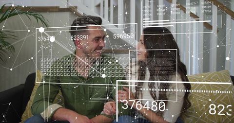 Couple Interacting with Digital Data Flow in Cozy Living Room