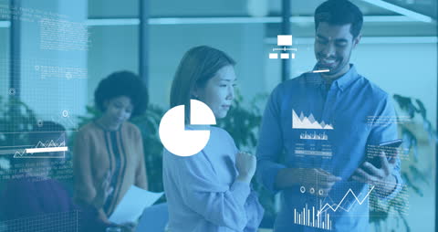 Diverse Team Analyzing Data with Digital Technology in Modern Office