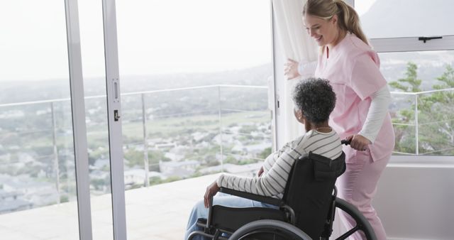 Nurse assisting elderly woman in wheelchair by sunny window - Download Free Stock Images Pikwizard.com