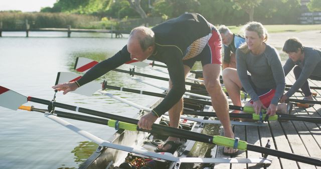 Rowing Team Preparing Boat on Dock for Early Morning Practice - Download Free Stock Images Pikwizard.com