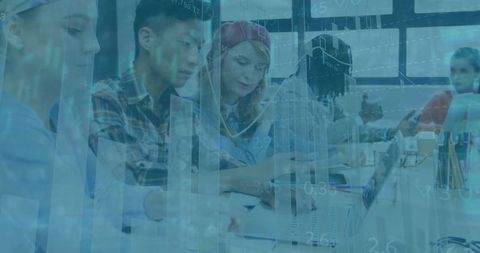 Diverse Team Collaborating with Laptops and Notebooks in Stylish Office
