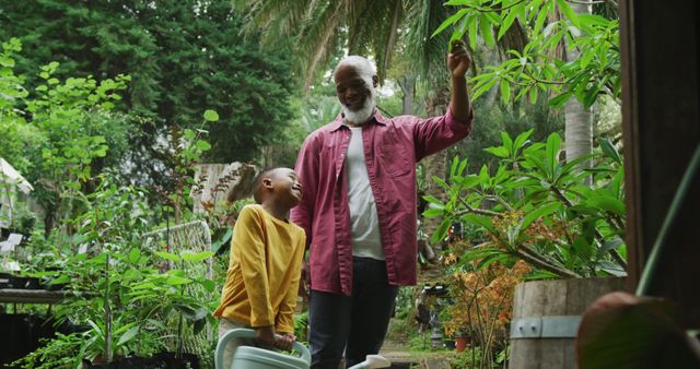 Grandfather and Grandchild Gardening Together in Lush Garden - Download Free Stock Images Pikwizard.com