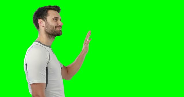 Man Waving in Activewear on Green Screen Background - Download Free Stock Images Pikwizard.com