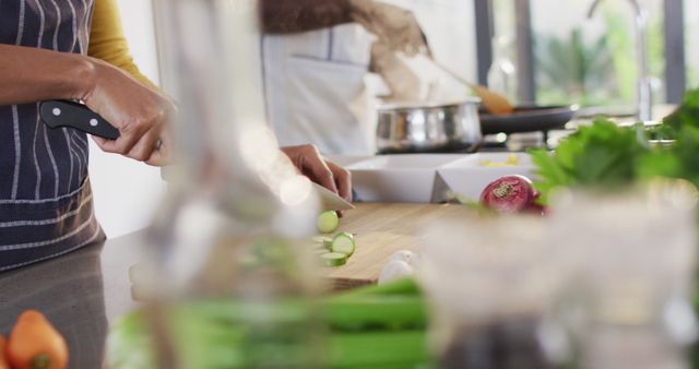 Close-up of People Preparing Fresh Vegetables in Modern Kitchen - Download Free Stock Images Pikwizard.com