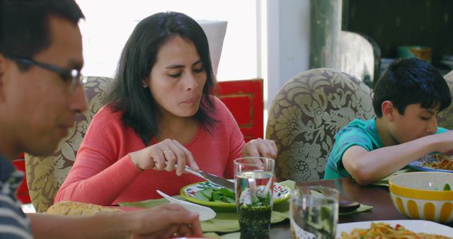 Latino Family Enjoying Meal Together at Home Dining Table - Download Free Stock Images Pikwizard.com