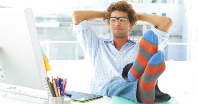 Relaxed Man with Colorful Socks Working from Home - Download Free Stock Images Pikwizard.com