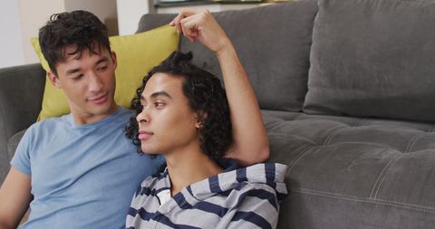 Happy Couple Relaxing Together in Cozy Living Room