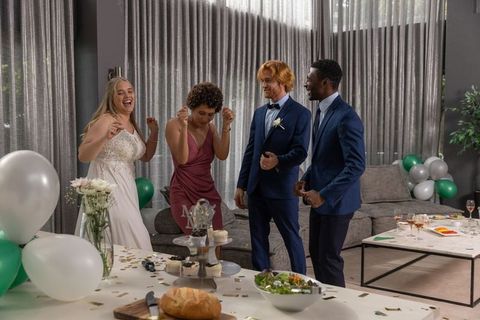 Diverse Wedding Party Dancing with Excitement at Reception