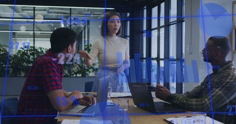 Diverse Team Collaborating on Data Analytics and Graphs