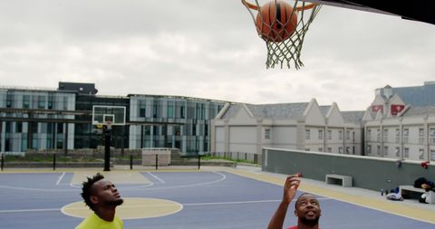Basketball Players Watching Ball Drop Through Hoop - Download Free Stock Images Pikwizard.com