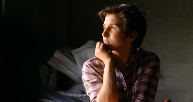 Pensive Young Man Looking Out Window - Download Free Stock Images Pikwizard.com