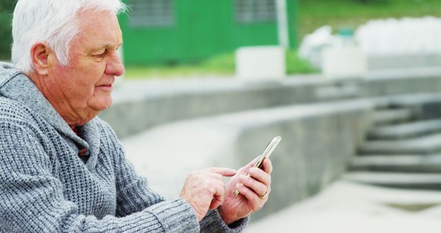 Senior Man Using Smartphone Outdoors in Park - Download Free Stock Images Pikwizard.com