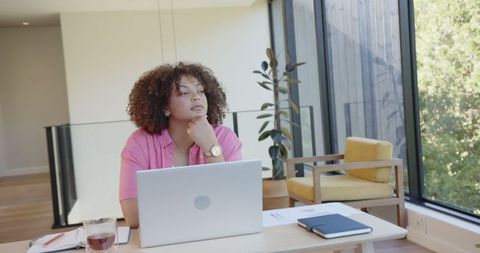 Focused Young Professional in Contemporary Home Office with Nature Views