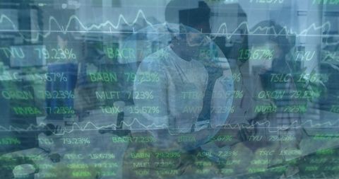 Coworkers Collaborating with Financial Data Overlay