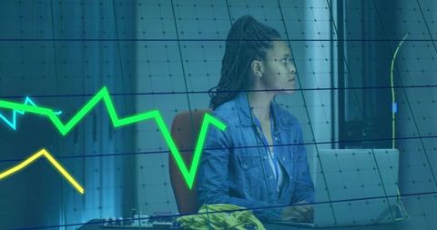 Engineer Analyzing Data with Laptop and Circuit Boards