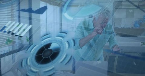 Senior man checking smartphone and interacting with holographic interface in home office