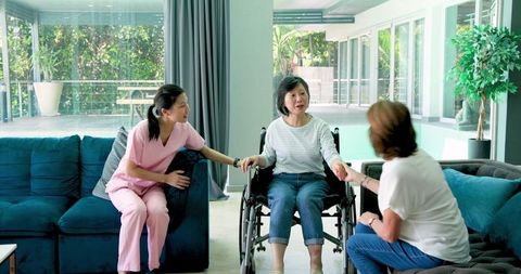 Multicultural Friendship with Senior Woman in Wheelchair