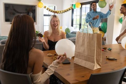 Diverse Friends Celebrating Birthday at Home with Balloons and Decorations