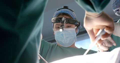 Surgeon performing procedure with precision surgical tools