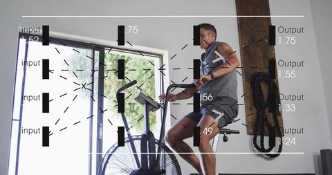 Man pedaling air bike with performance analytics overlay for indoor fitness hiit training