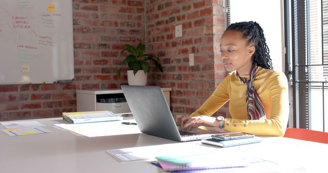 Businesswoman Working on Laptop in Bright Office - Download Free Stock Images Pikwizard.com