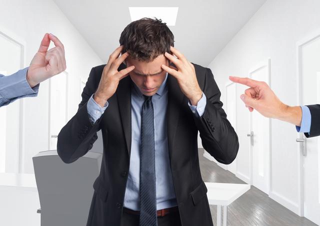 Businessman experiencing frustration and stress in office setting with hands on forehead. Useful for content depiction workplace stress, mental health awareness, corporate anxiety, and professional challenges in a business environment. Ideal for illustrating articles, blog posts, and presentations on stress management, mental health at work, and the pressures of corporate life.
